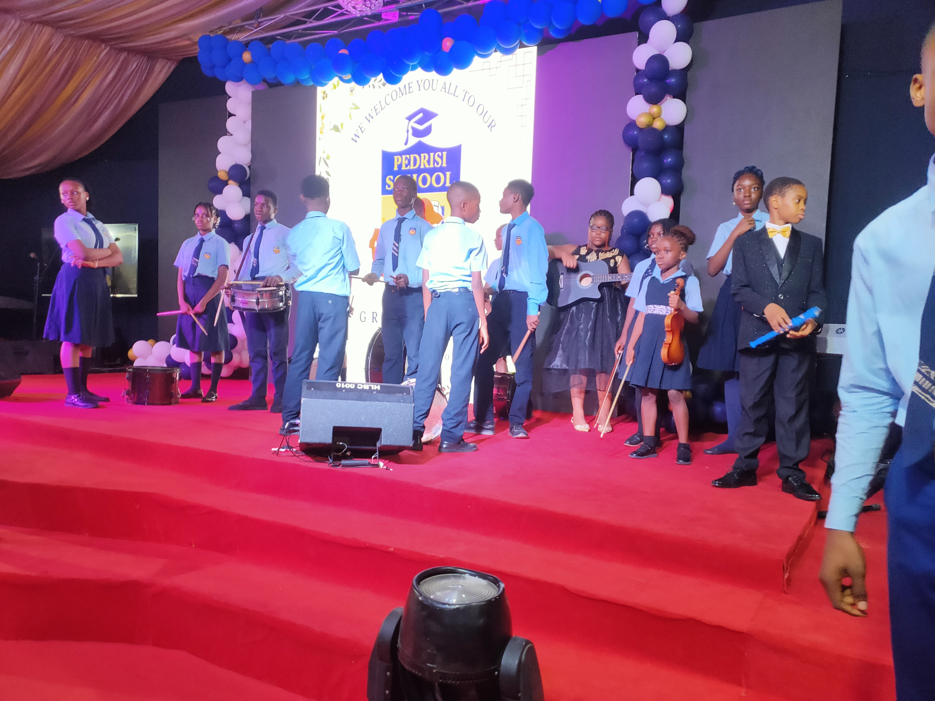 Pedrisi school band performing on stage