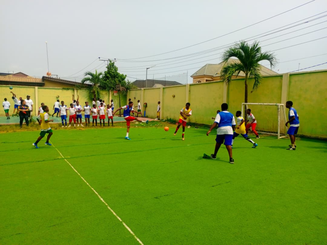 Pedrisi boys playing football on campus pitch